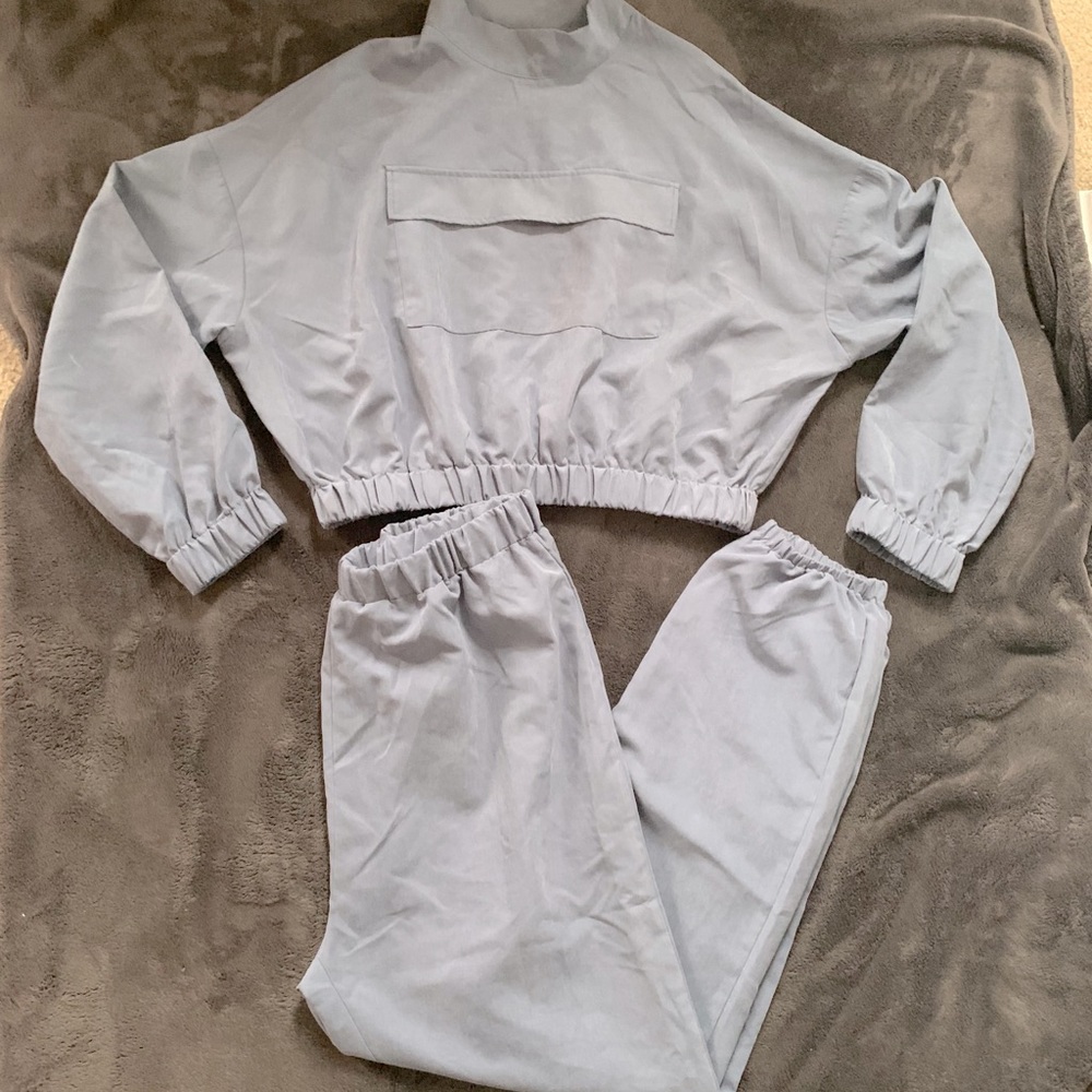 Two piece sweatsuit with zip neck